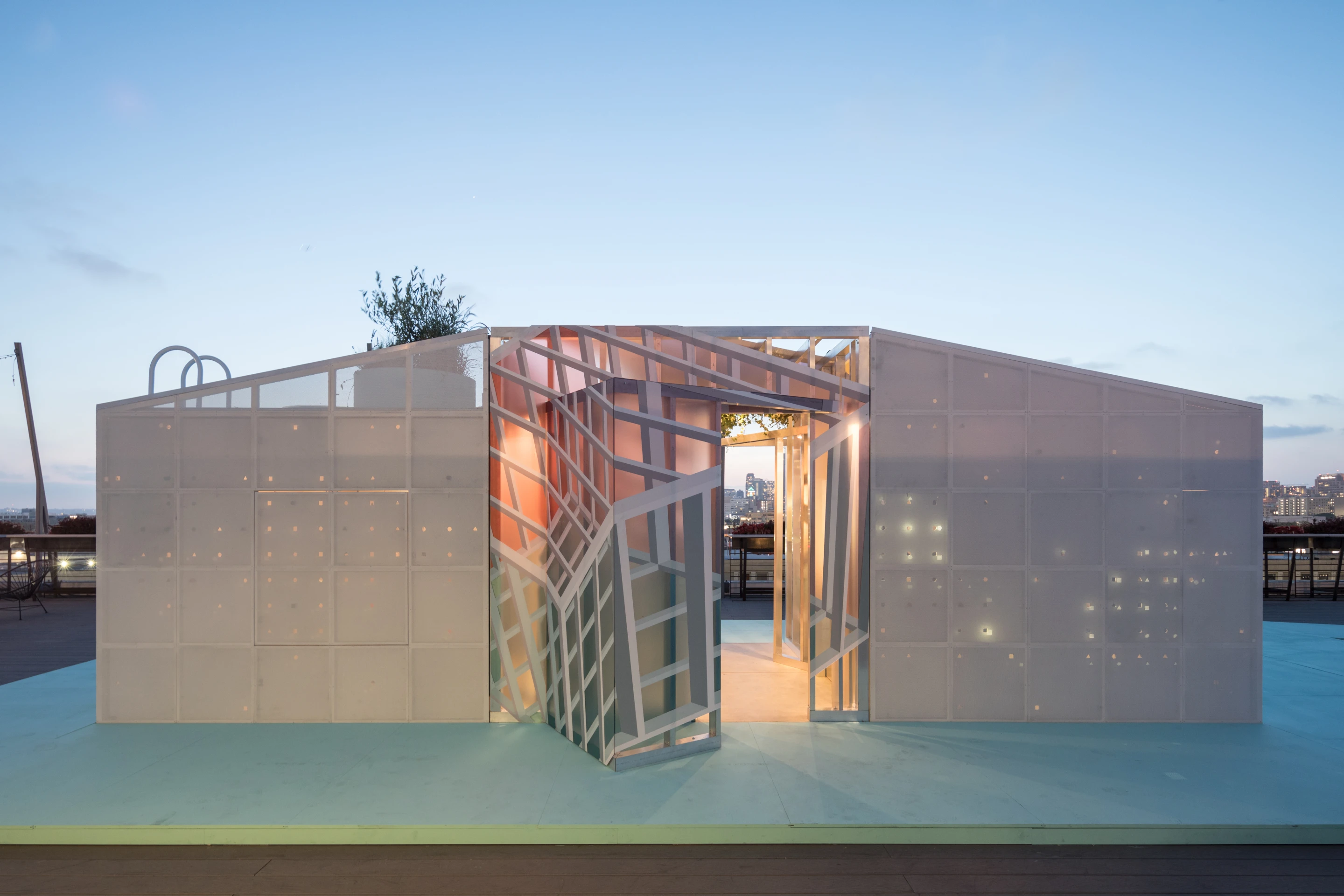 Space-saving mechanisms like folding dining tables and shelves and rotating panels feature throughout Mini's urban cabin concept in LA
