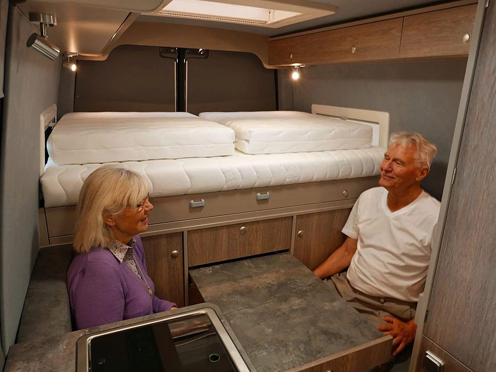 The simple dining area seats two at a pull-out table