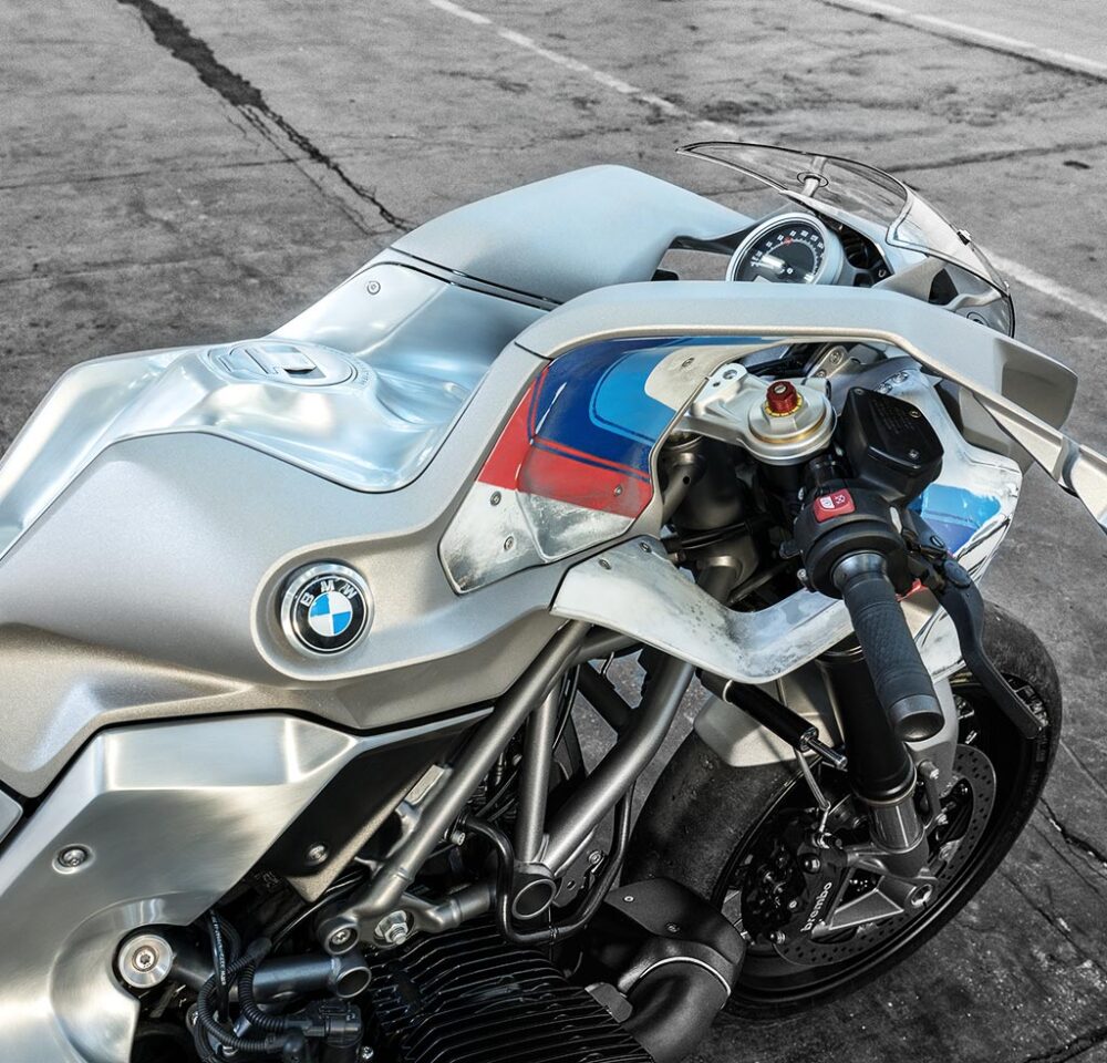 The tank extends forward over and under the clip-on bars, and the tank indentation is at once bizarre and familiar