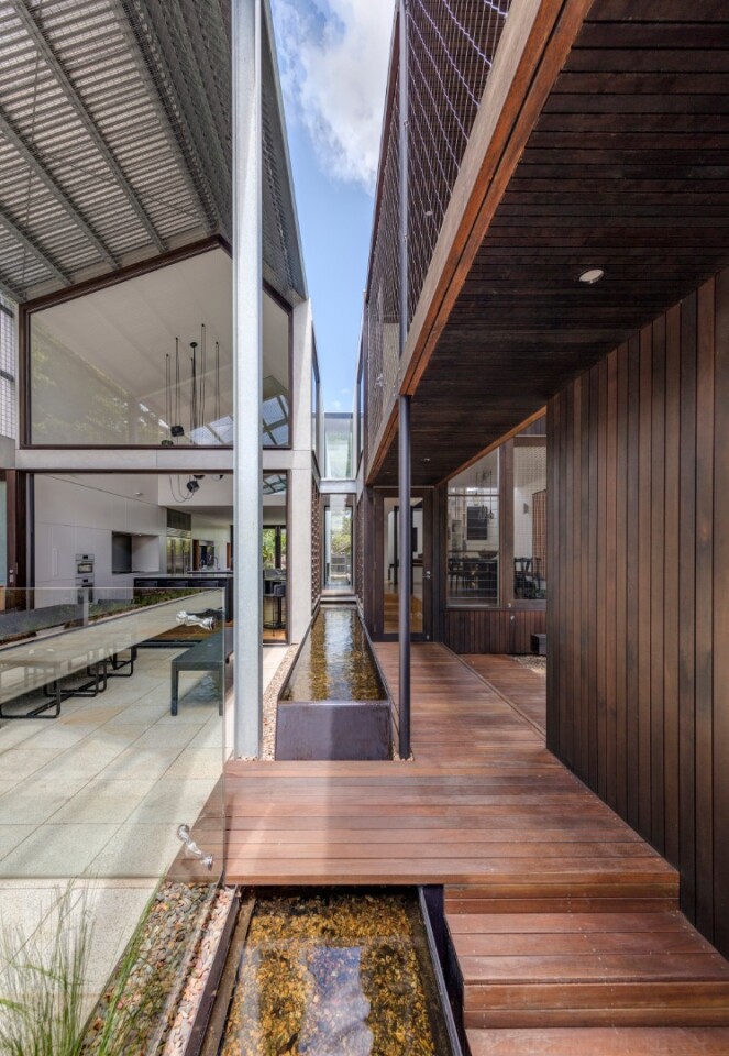 A void designed to mimic a natural gorge runs down the middle of the Iron Maiden House in Sydney