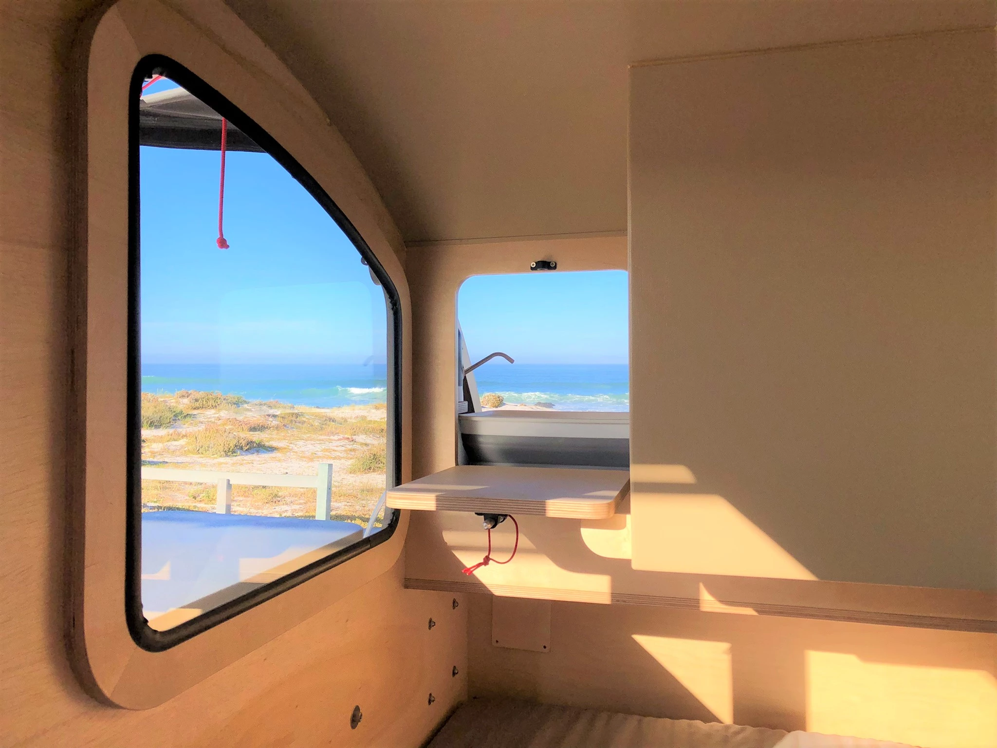 The drop-down pass-through hatch makes it easier to move food, drink and dishware between inside and out and also allows campers to grab a drink in the middle of the night without exiting the trailer