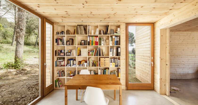 The plain unfussy interior contains a single bathroom, kitchen, three bedrooms, plus a dining area, lounge, and garage (Photo: Adrià Goula)