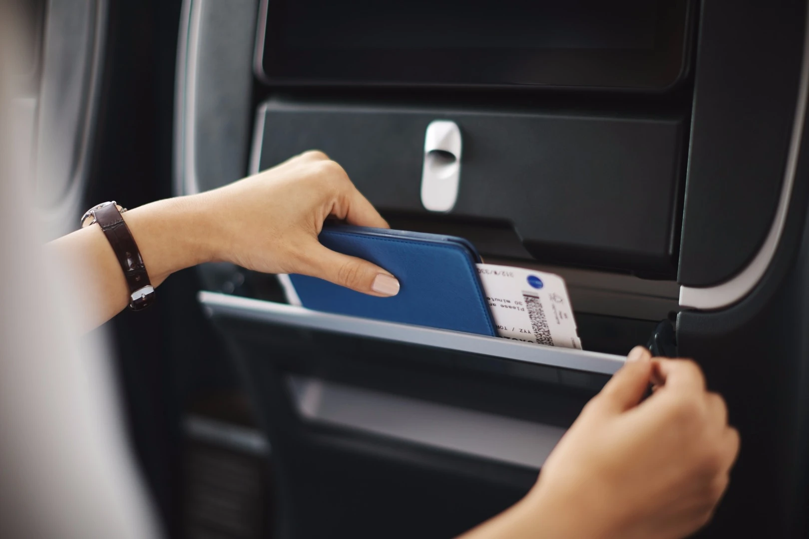 There is space for storing personal items and a drinks holder