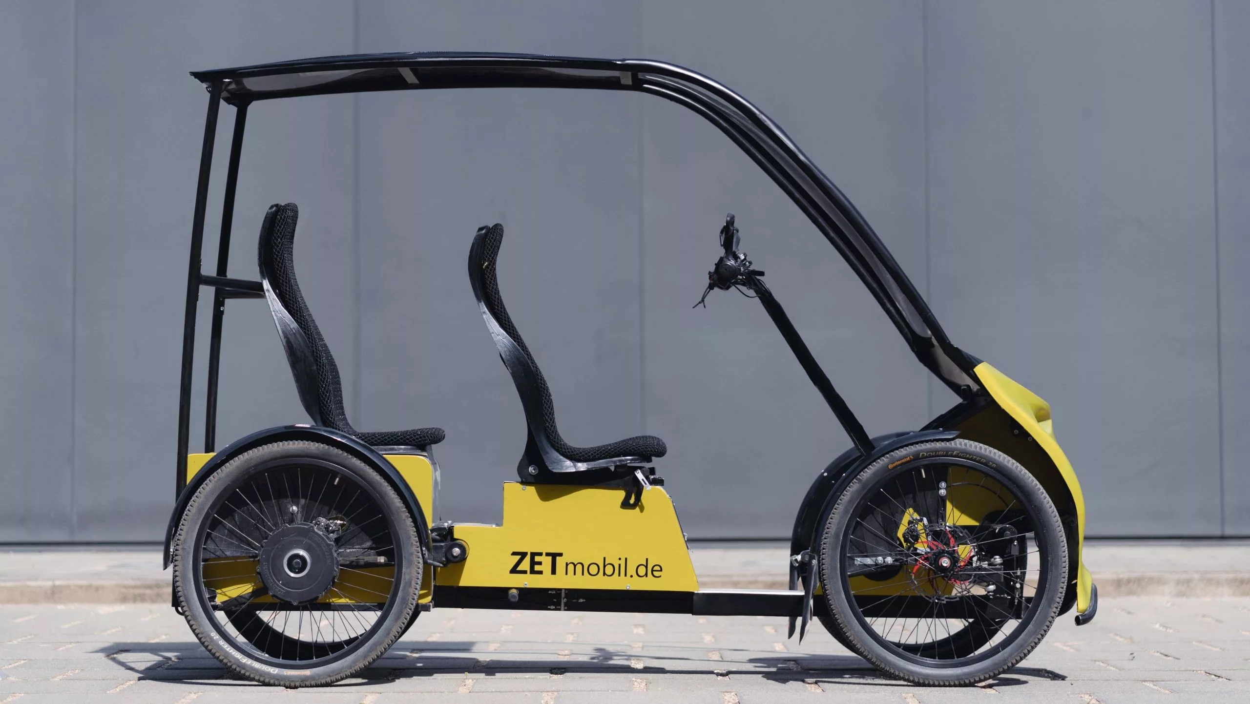 Adult seating for two, windshield and canopy, and optional solar panels to top up the battery