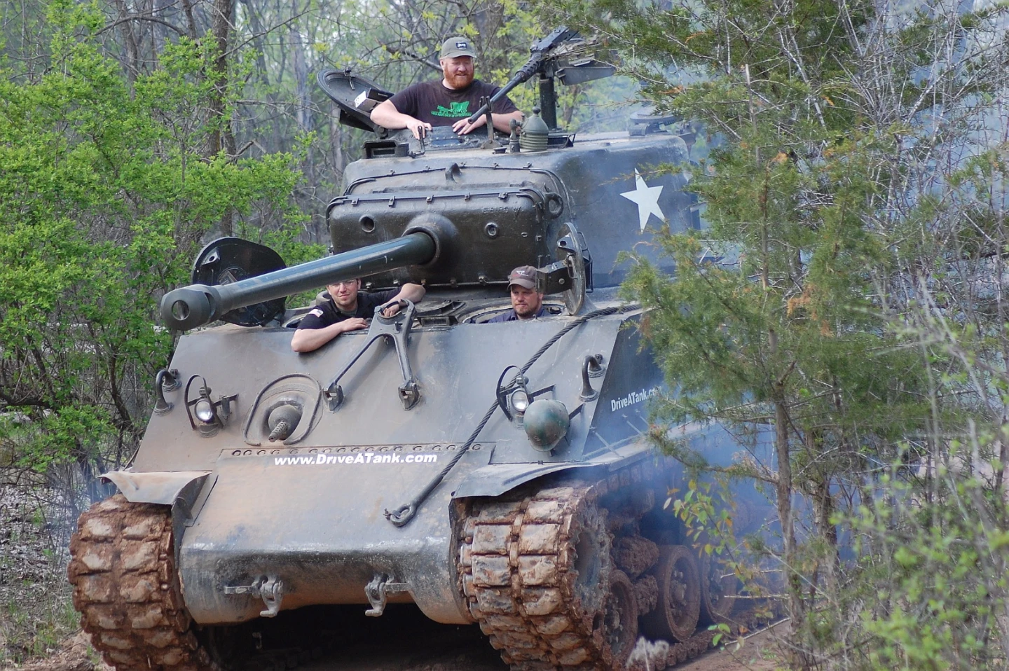 Here, the author sits in the gunner's position atop the M4's turret and journalist Tim Esterdahl drives as Tony Borglum instructs