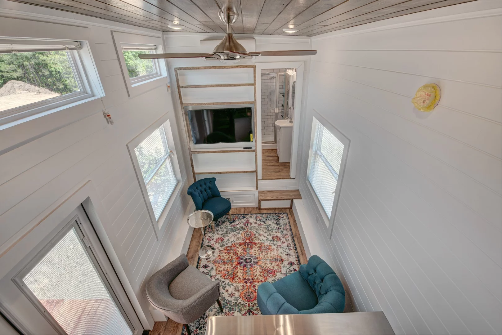 The high ceiling throughout the Journey tiny house gives this luxurious pint-sized dwelling a relatively spacious interior