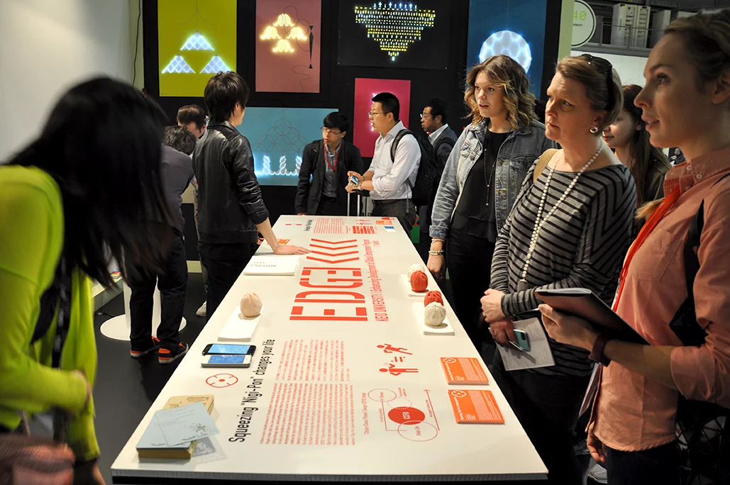 Keio University students demonstrate how their stress ball generates energy for simple daily tasks (Photo: Edoardo Campanale/Gizmag.com)