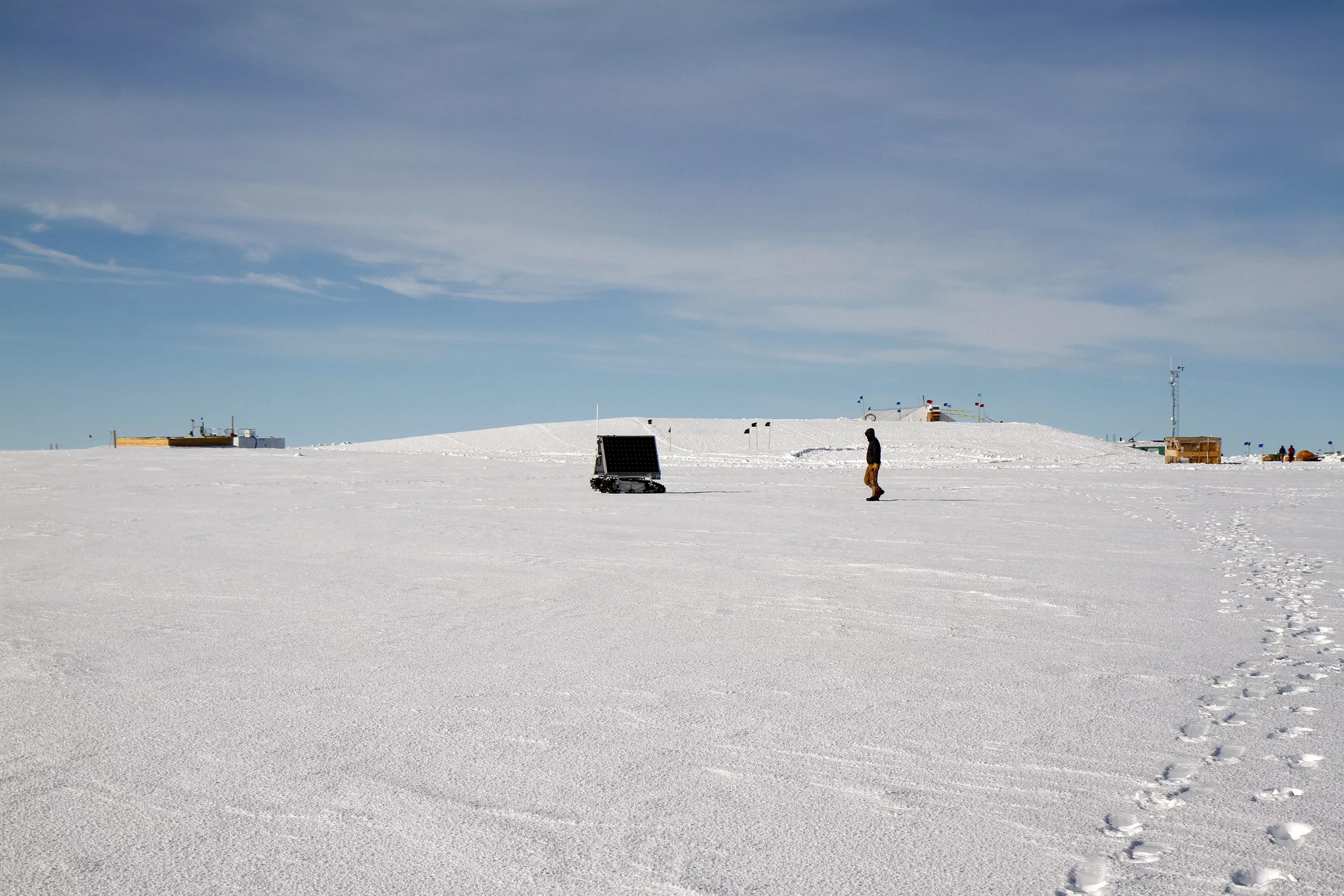 Mark Robertson follows behind GROVER while it is being controlled from Idaho by his advisor, Hans-Peter Marshall (Photo: NASA Goddard/Matt Radcliff)