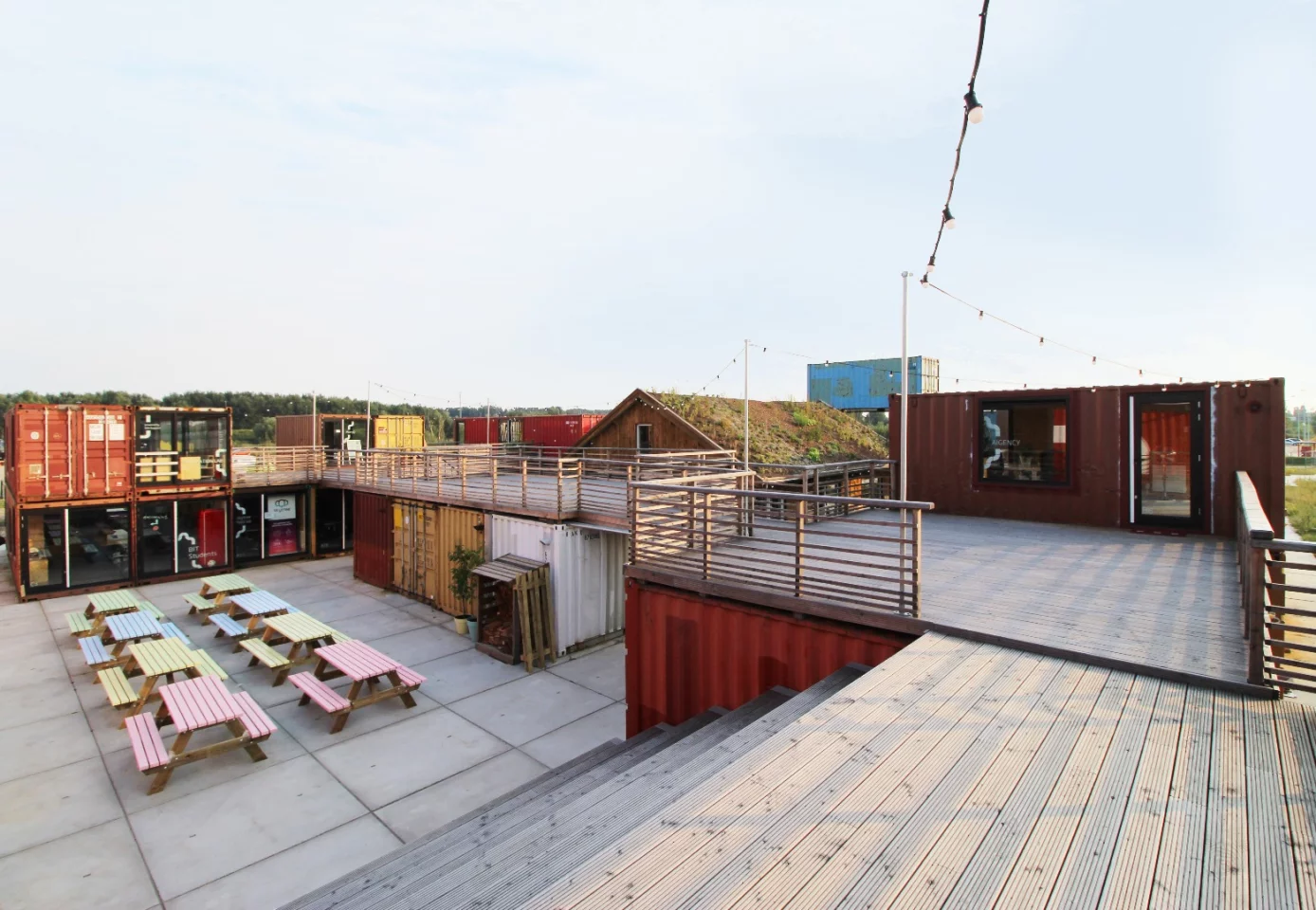 At the heart of Startup Village is communal outdoor space for events, with the shipping containers stacked around it