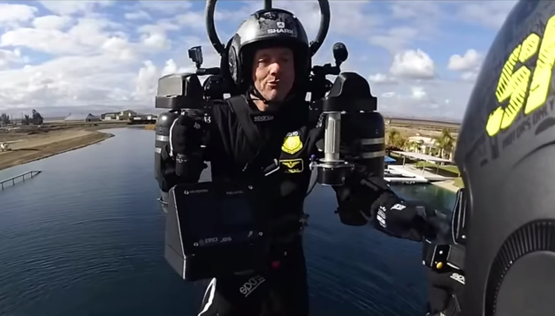 Boop! Jetpack Aviation founder, CEO and chief test pilot David Mayman reaches out to poke his colleague Boris Jarry as they fly together