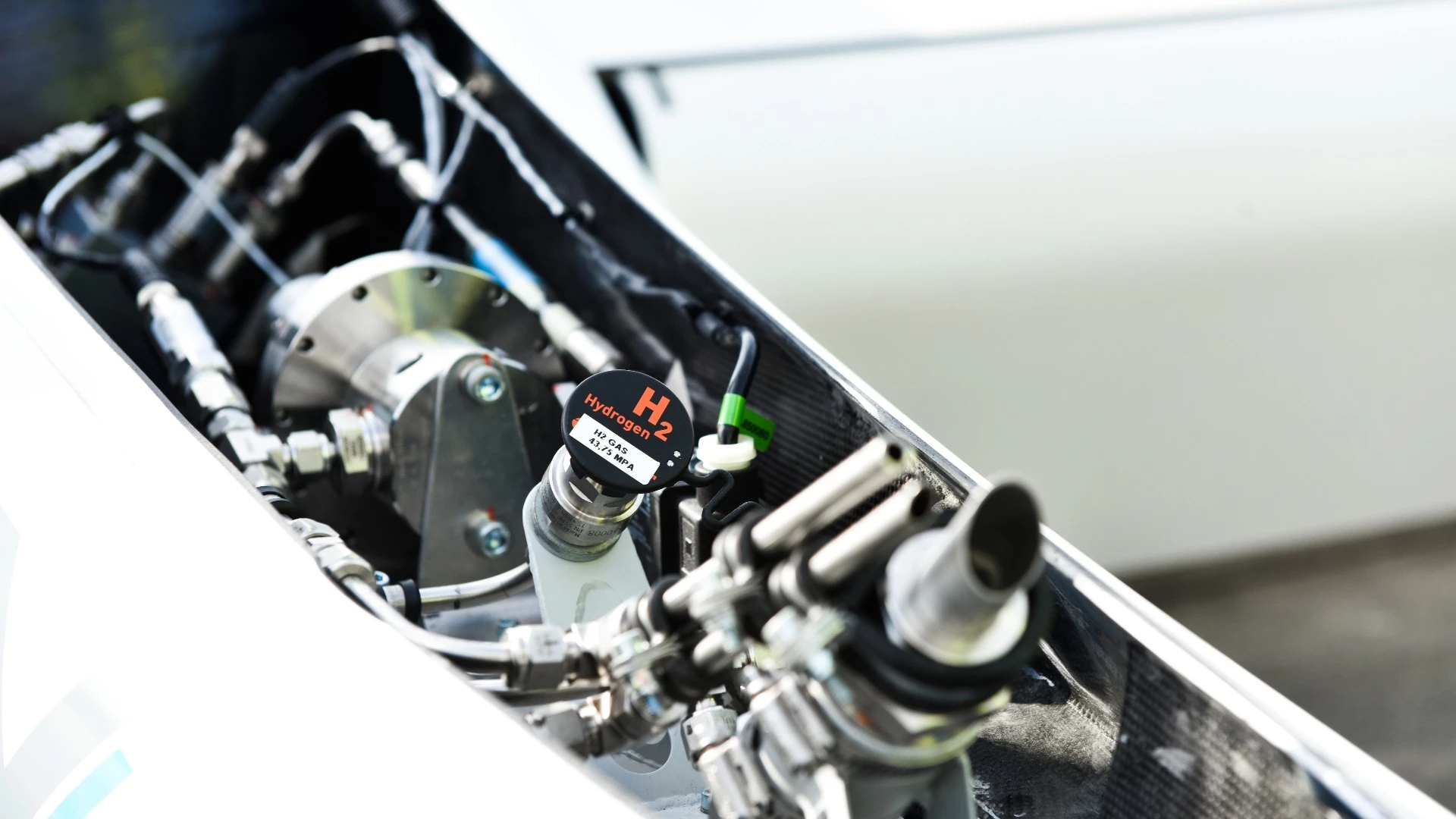 Four low temperature Proton Exchange Membrane fuel cell modules sit behind the 80 kW electric motor and single propeller