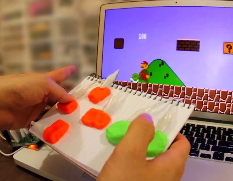 The MaKey MaKey is an Arduino-based circuit that can be connected to everyday objects, transforming them into playful interfaces