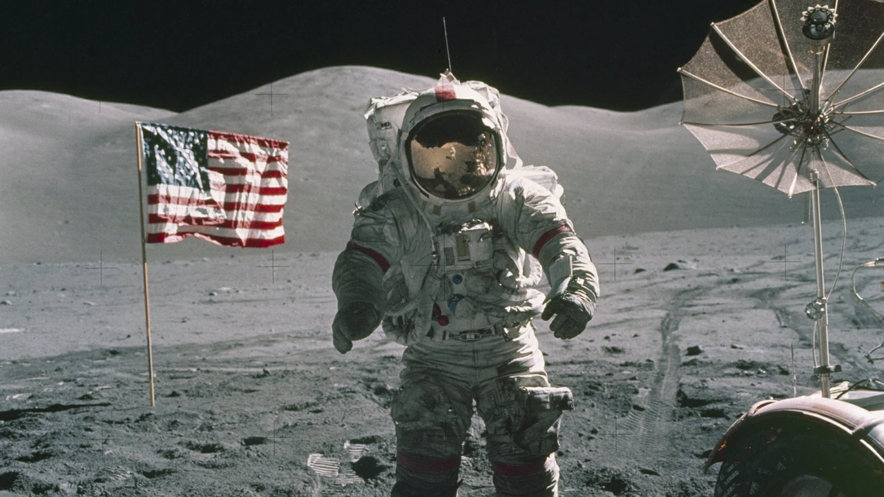 NASA astronaut stands in front of the American flag during the Apollo 17 mission