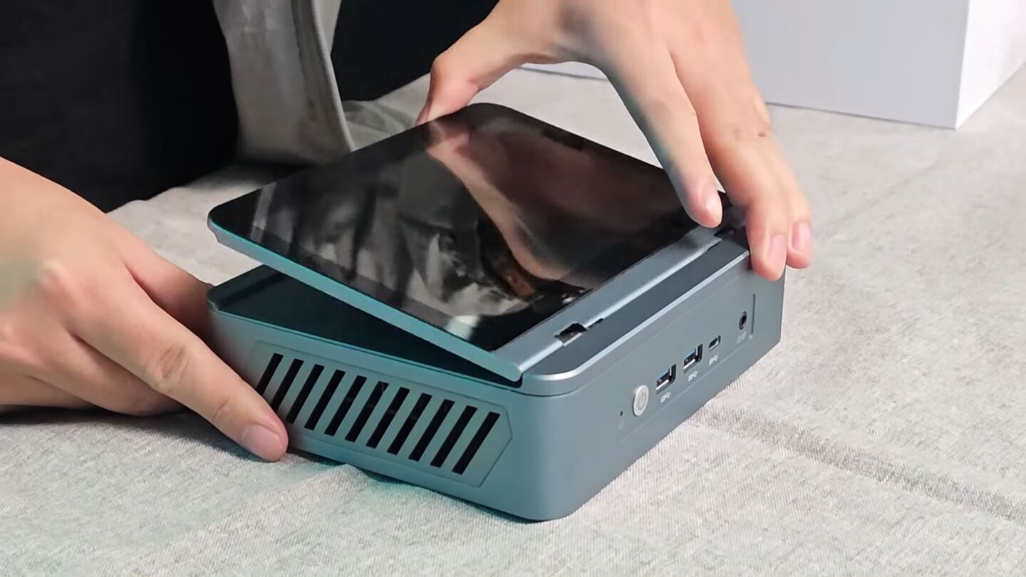 The hinged touchscreen monitor can be set at any angle from flat to vertical