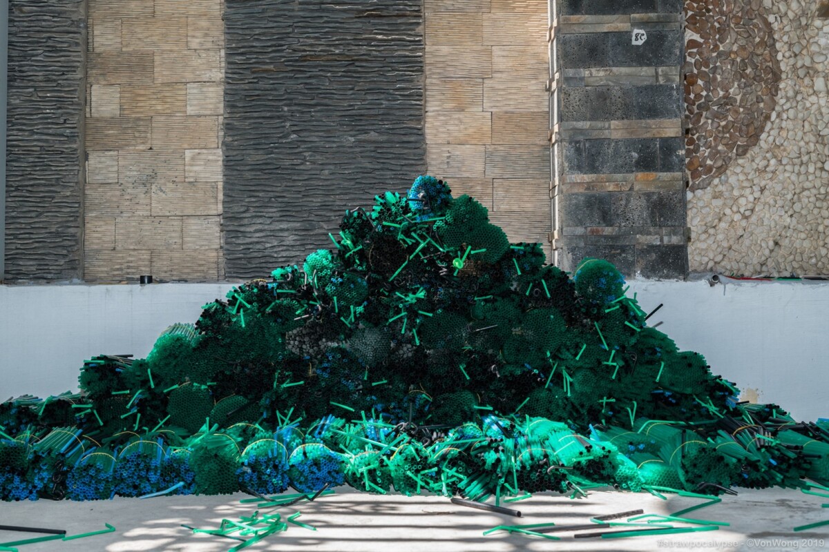 Organized plastic straws during construction of the Strawpocalypse installation