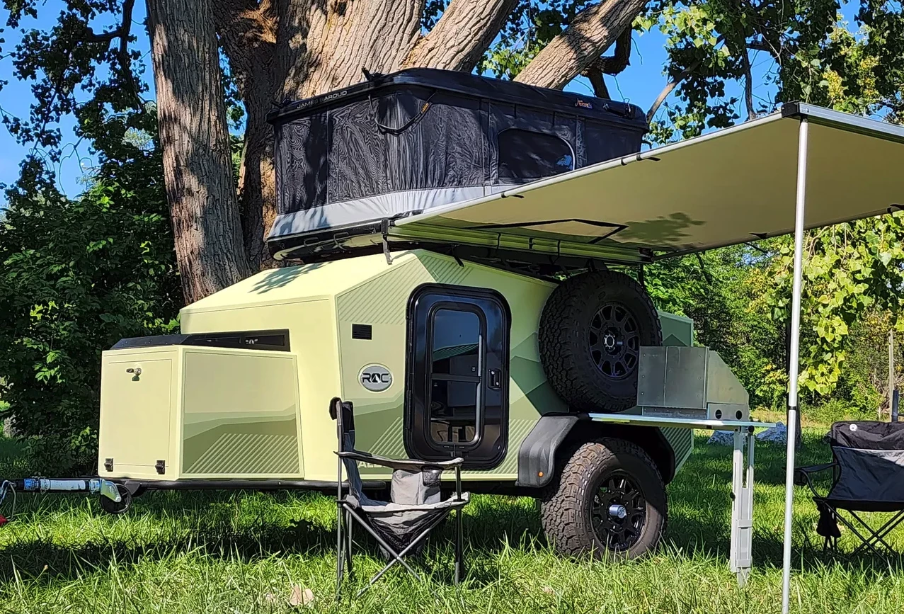 Options include the tongue box with fridge slide, a second entry door, an awning, and James Baroud or Front Runner rooftop tent