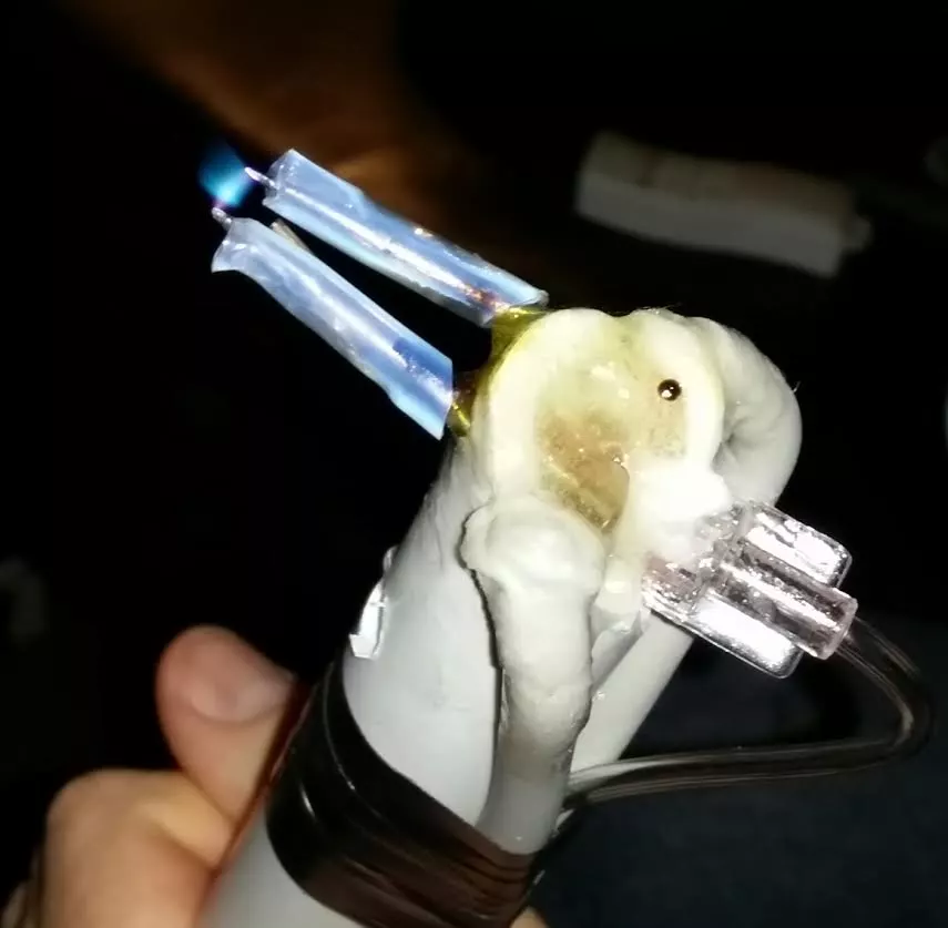 "That's my DIY Hydrogen atomic disassociation torch. It's so simple, just an H2 generator feeding a hypodermic needle with a pair of tungsten TIG welding electrodes fed by a 15KV 30mA transformer to split the H2 into H from the plasma. When the H recombines into H2 it makes temperatures capable of melting diamond and just about everything else. I built it to process some of the materials to make my wife's wedding ring."