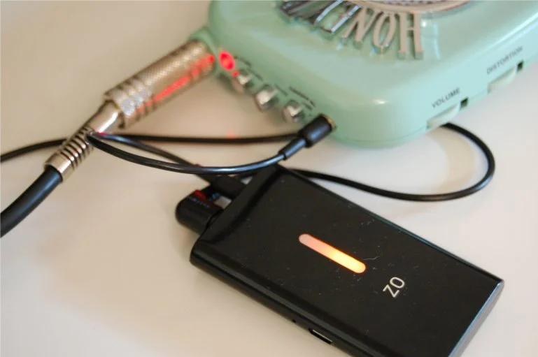 Not designed for use with guitar amplifiers but coped quite well with a HoneyTone