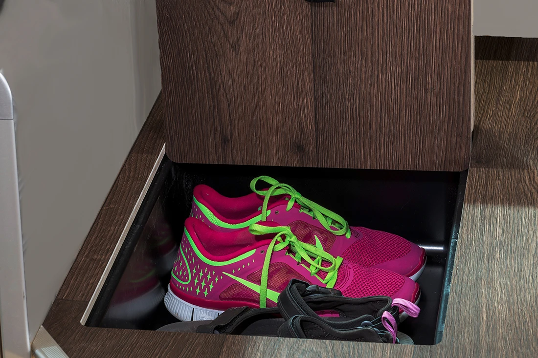 Under-floor storage below the table