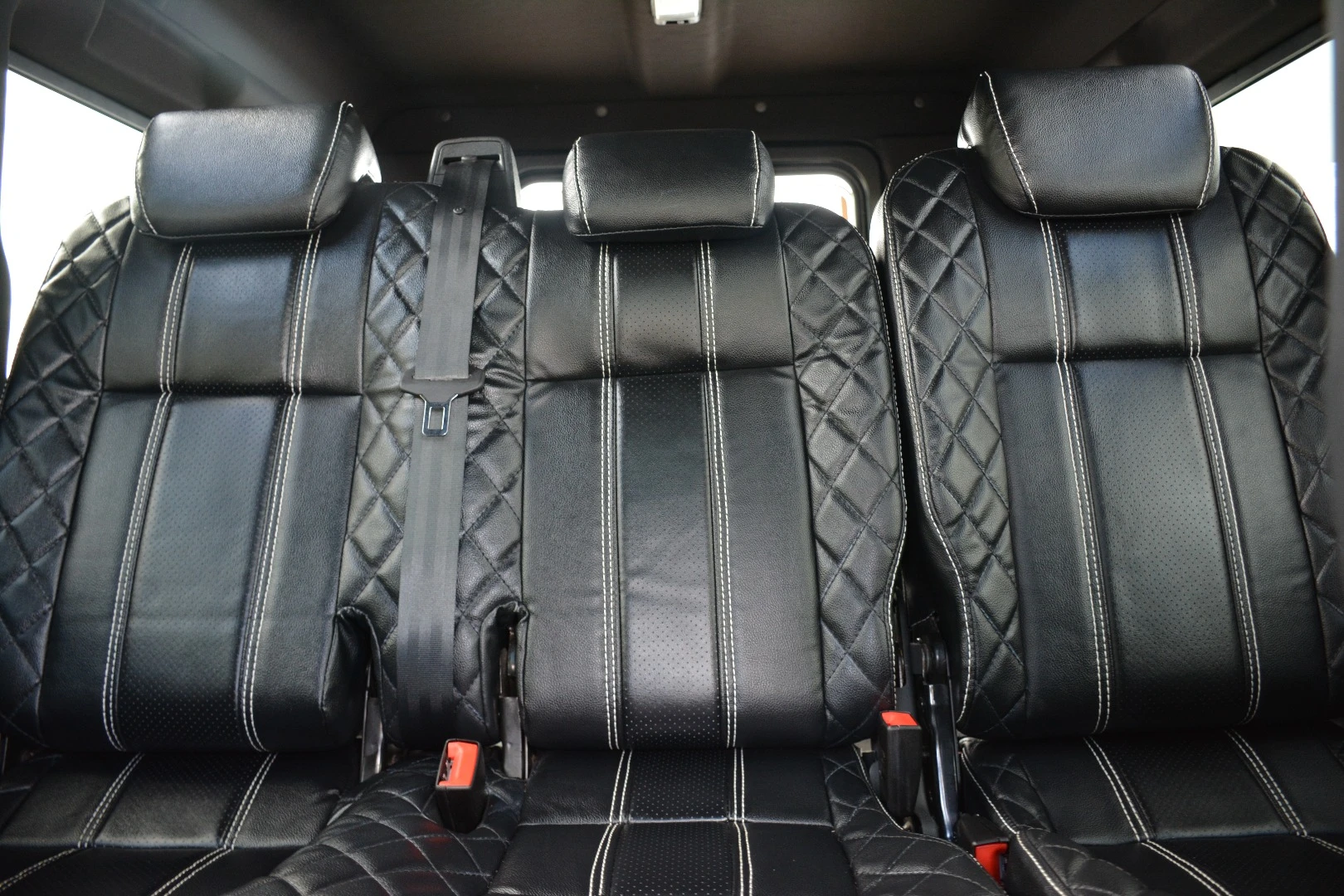 The interior features hand-stitched leather throughout
