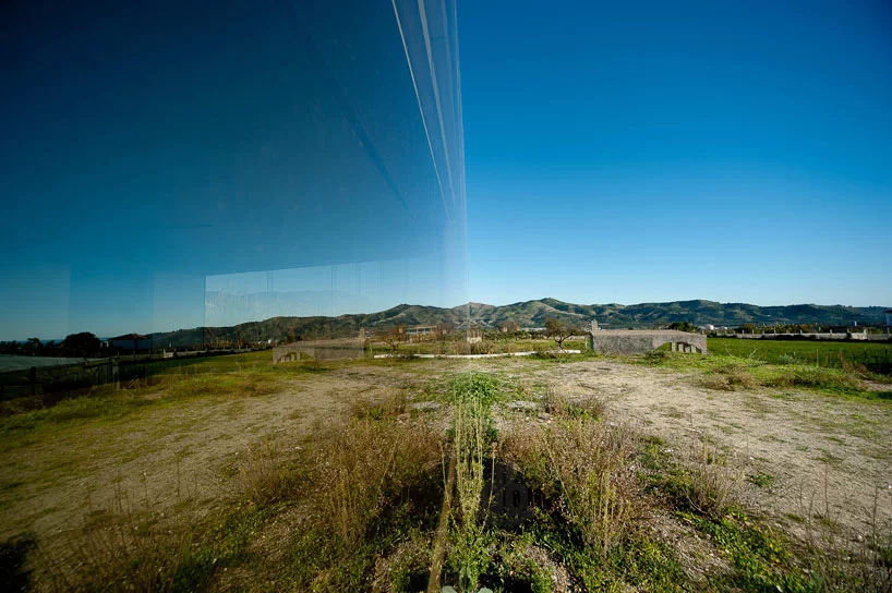 The glass exterior almost cloaks the structure with an invisible blanket