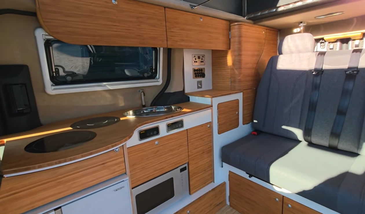 In the PV5 Kingfisher, Sussex updates the classic side kitchen small camper floor plan for the modern world