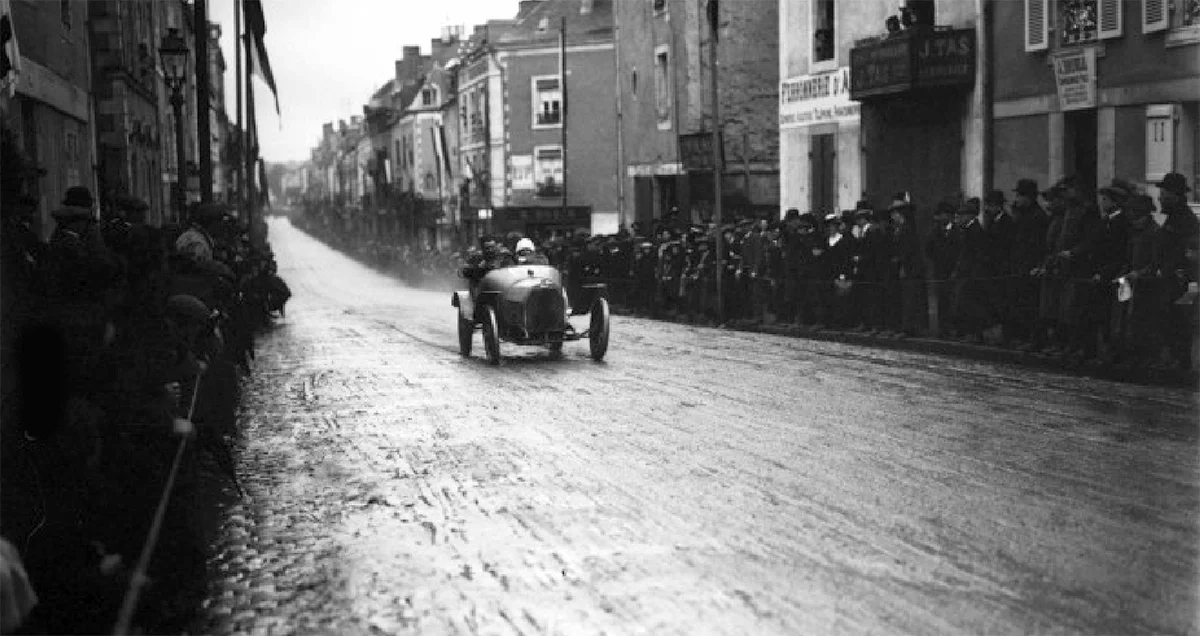 Friedrich's Bugatti T13 barrels through Laval township during a race at Laval during 1913