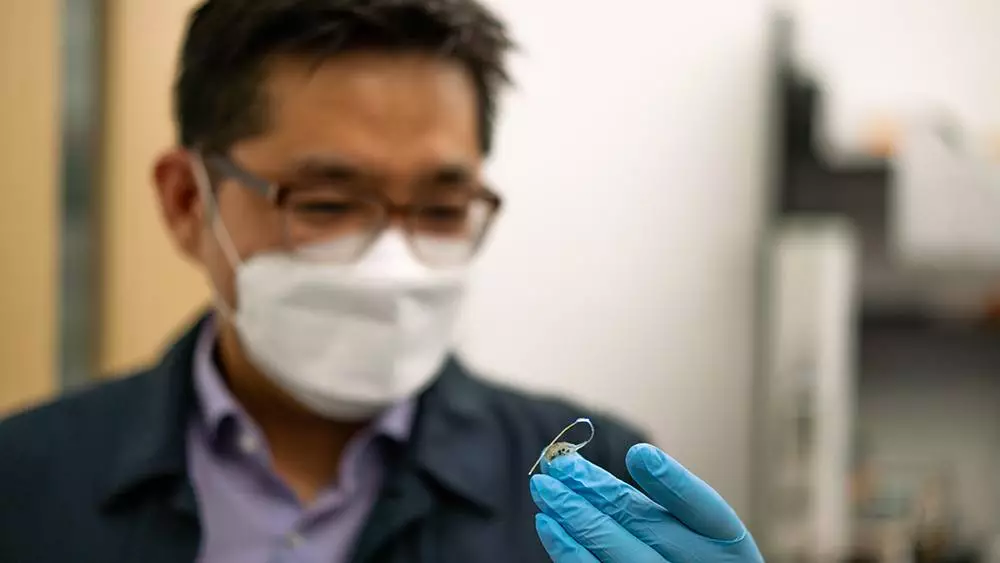 Asst. Prof. Sung Il Park with the prototype implant