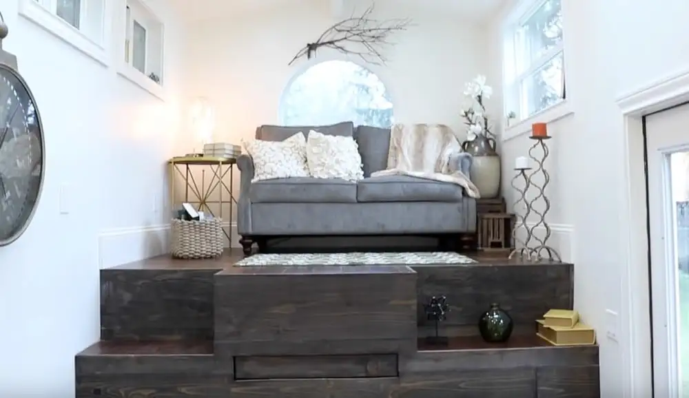 The Vintage Glam's motorized platform includes bench seats, table, bed, and stairs, all of which is revealed with the flick of a switch