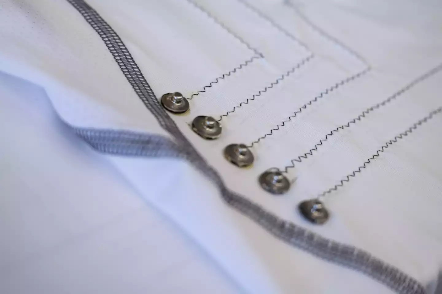 Conductive fibers were sewn into the shirt in a zig-zag pattern to prevent them stretching and breaking