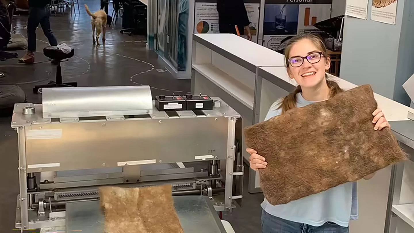 Matter of Trust volunteer gleefully holding up a hair mat...bare handed. I feel like I would be wearing gloves