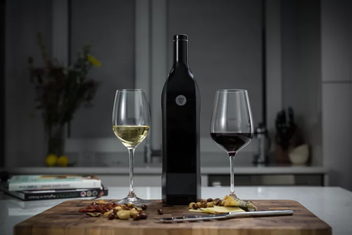 The Kuvee smart wine bottle features an integrated touchscreen, Wi-Fi connectivity, sensors, and an internal battery that's good for up to six hours per charge