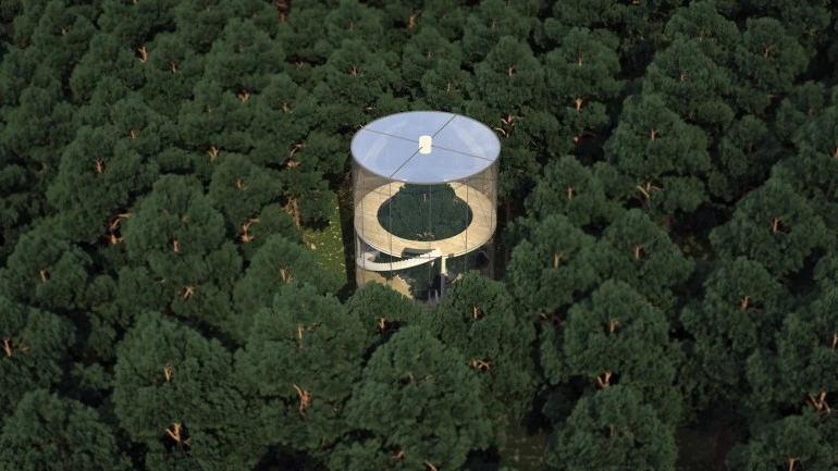 The unusual home is a simple structure consisting of a cylindrical glass shape and four floors accessible via spiral staircase (Image: A.Masow)