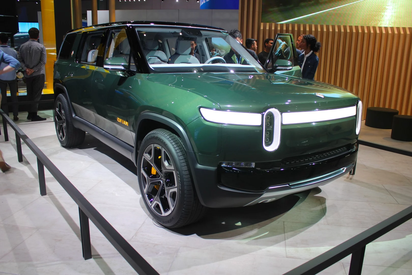 After its press conference outside the main exhibition hall, the Rivian R1S electric SUV finds a home inside