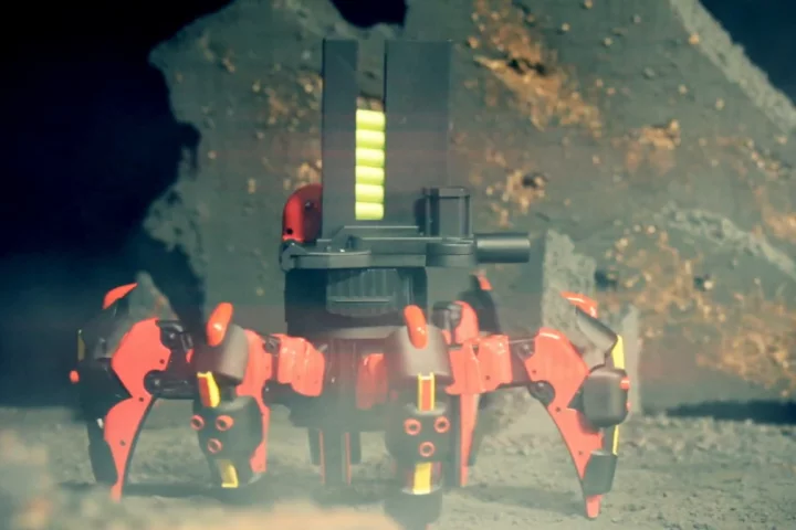 The toy robot's launchers can be aimed by remotely tilting it and shoots farther when the fire button is held down longer