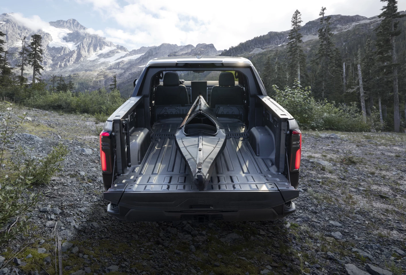 With its MultiPro Midgate and MultiPro Tailgate, the Sierra EV's bed expands from just under 6 feet to just under 11 feet, carrying oversized gear like kayaks, canoes or surfboards