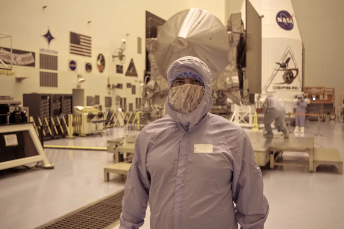 NASA takes it's clean room precautions seriously, but it's hard to take a journalist dressed like this the same way