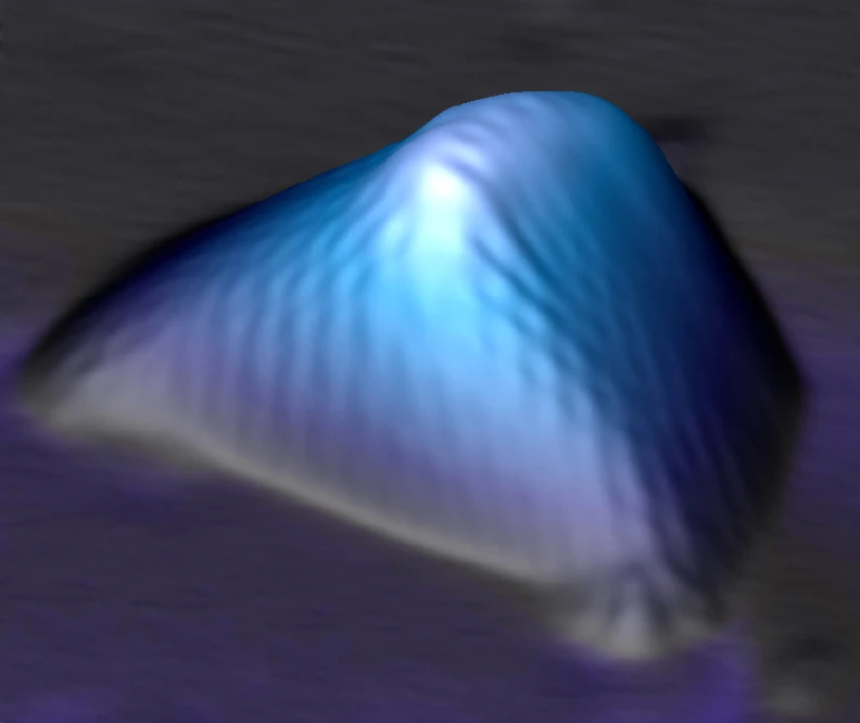 Scanning tunneling microscopy image of a graphene nanobubble, where the hexagonal two-dimensional graphene crystal is seen distorted and stretched along three main axes, creating pseudo-magnetic fields far stronger than any magnetic field ever produced in the laboratory