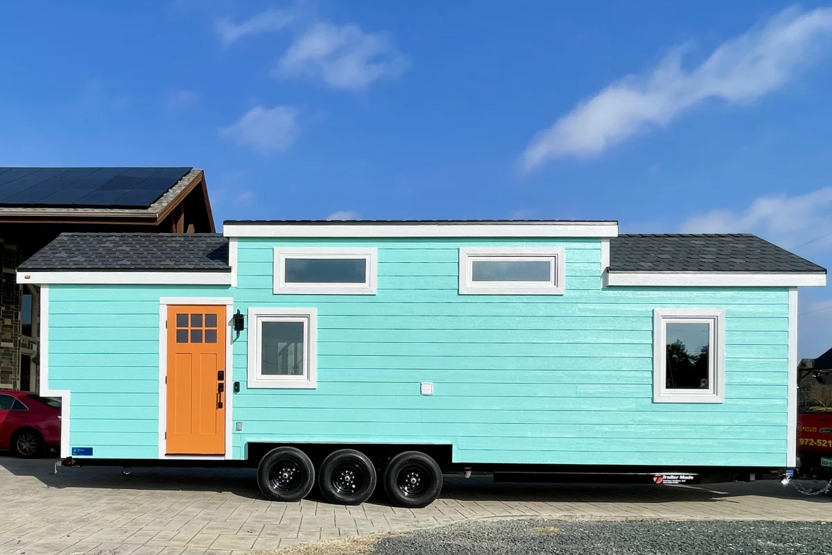 The Lady Bird has a length of 32 ft (9.75 m) and features a space-saving interior that fits both a downstairs master bedroom and a loft