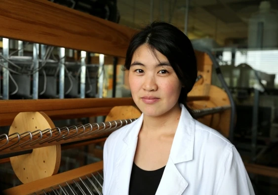 Joanna Ng with the state-of-the-art computer-controlled jacquard loom
