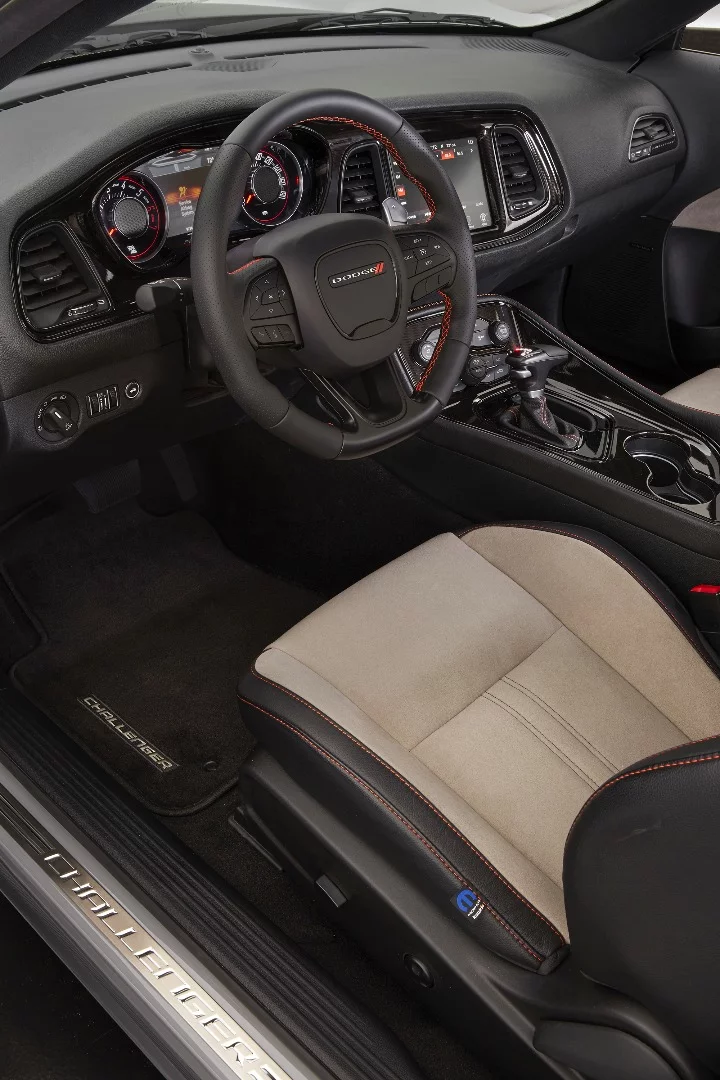 Inside, the Dodge Challenger GT AWD continues with the Header Orange color in its stitching on the Katzkin leather