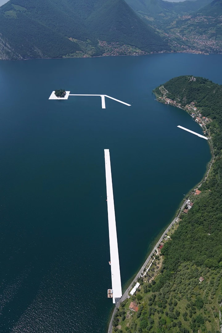 One by one, workers install the 100 by 16 meter sections to connect the island of San Paolo with the island of Monte Isola