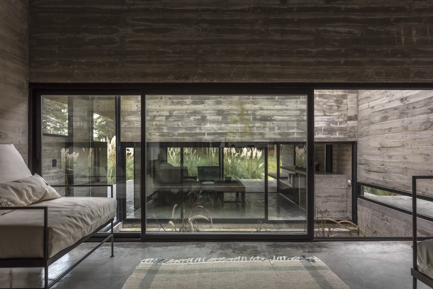 Small landscaped courtyards throughout the Forest House invite light and vegetation into the interior