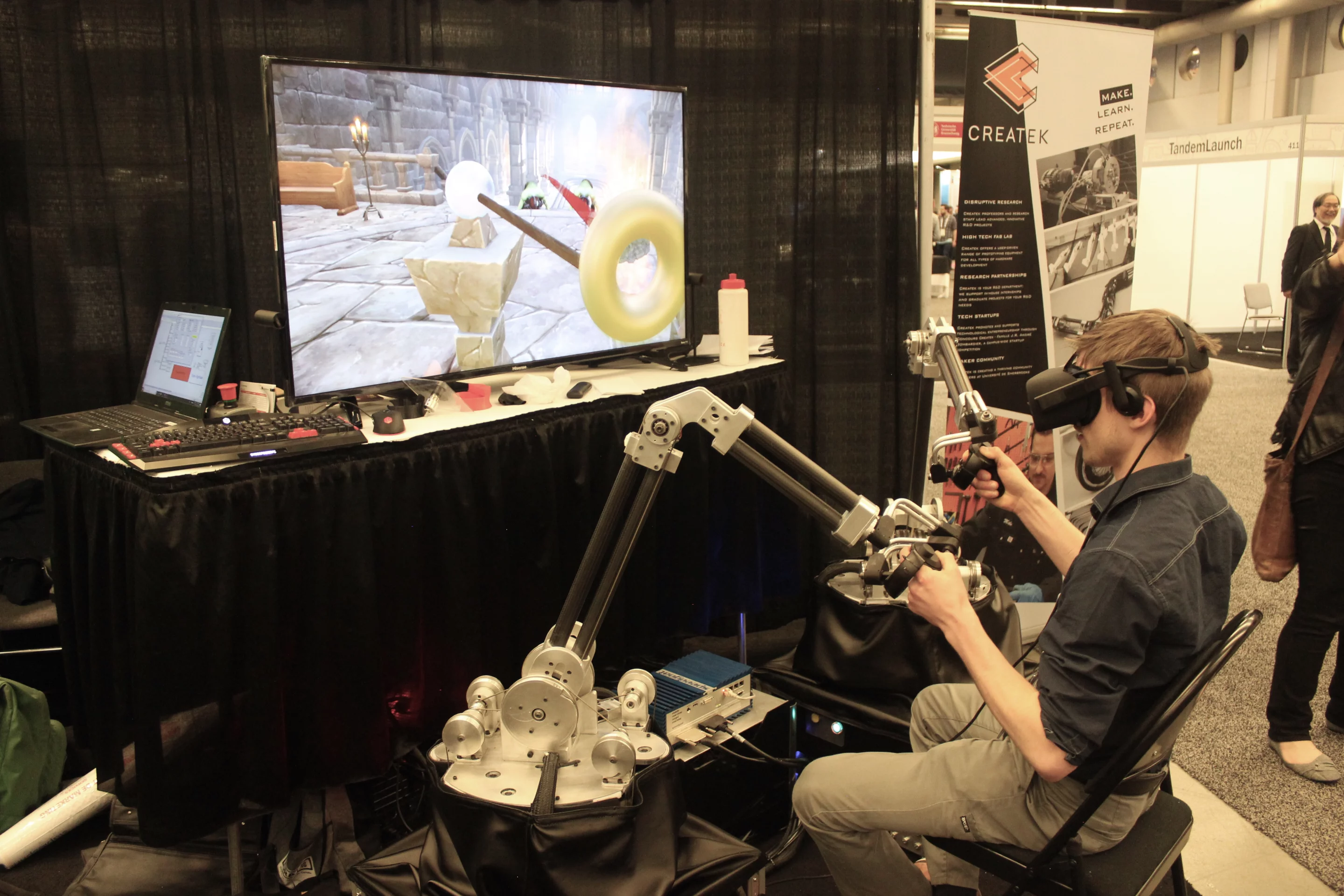 Quebec's Sherbrooke University was demoing this force-feedback system, used to control the onscreen action in a fantasy video game