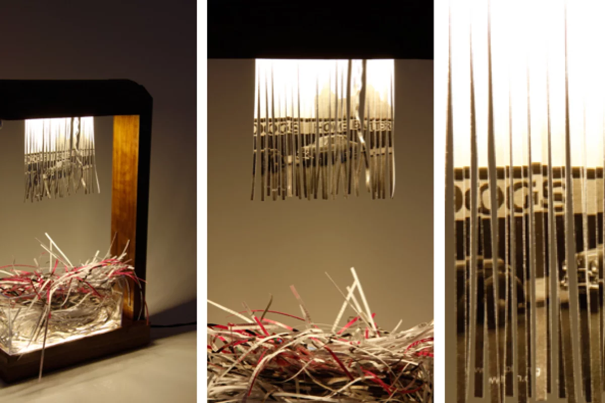 Eliminator by Merve Kahraman is a table lamp that uses the hanging curtain of shredded paper as a design feature