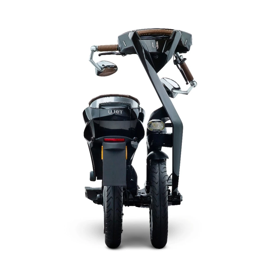 The scooter itself folds up and rolls like a trolley