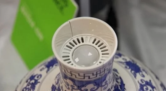 Hot air is expelled from the top of the vase