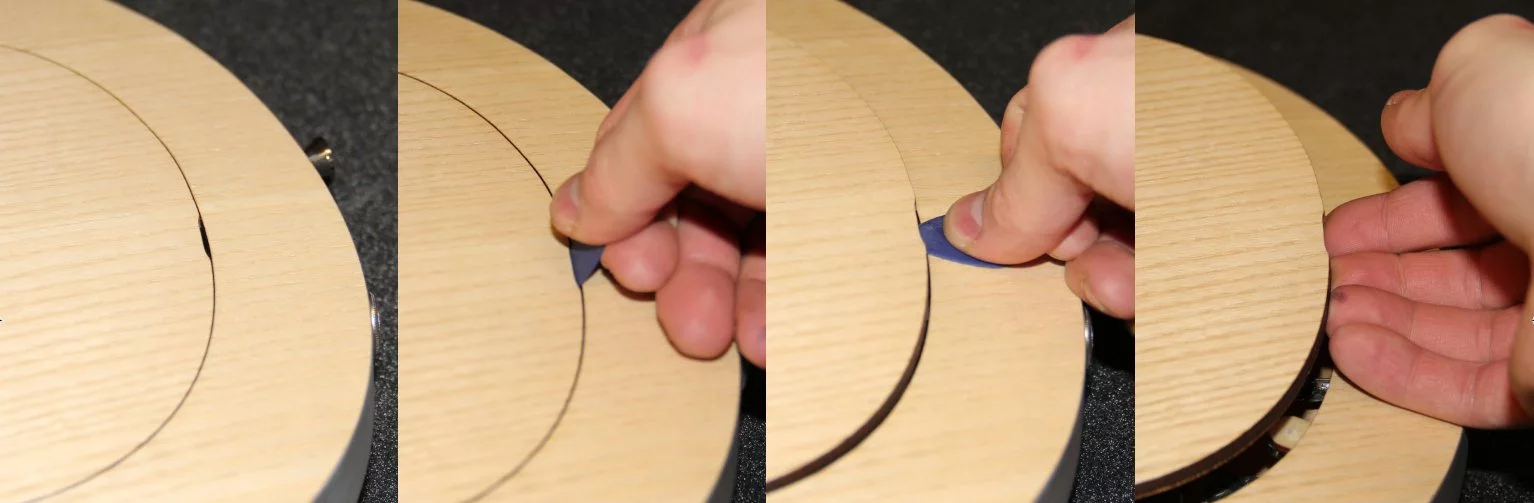 The back plate is held in place by nine magnets and can be removed by slotting a pick into a recess at the back edge and lifting up