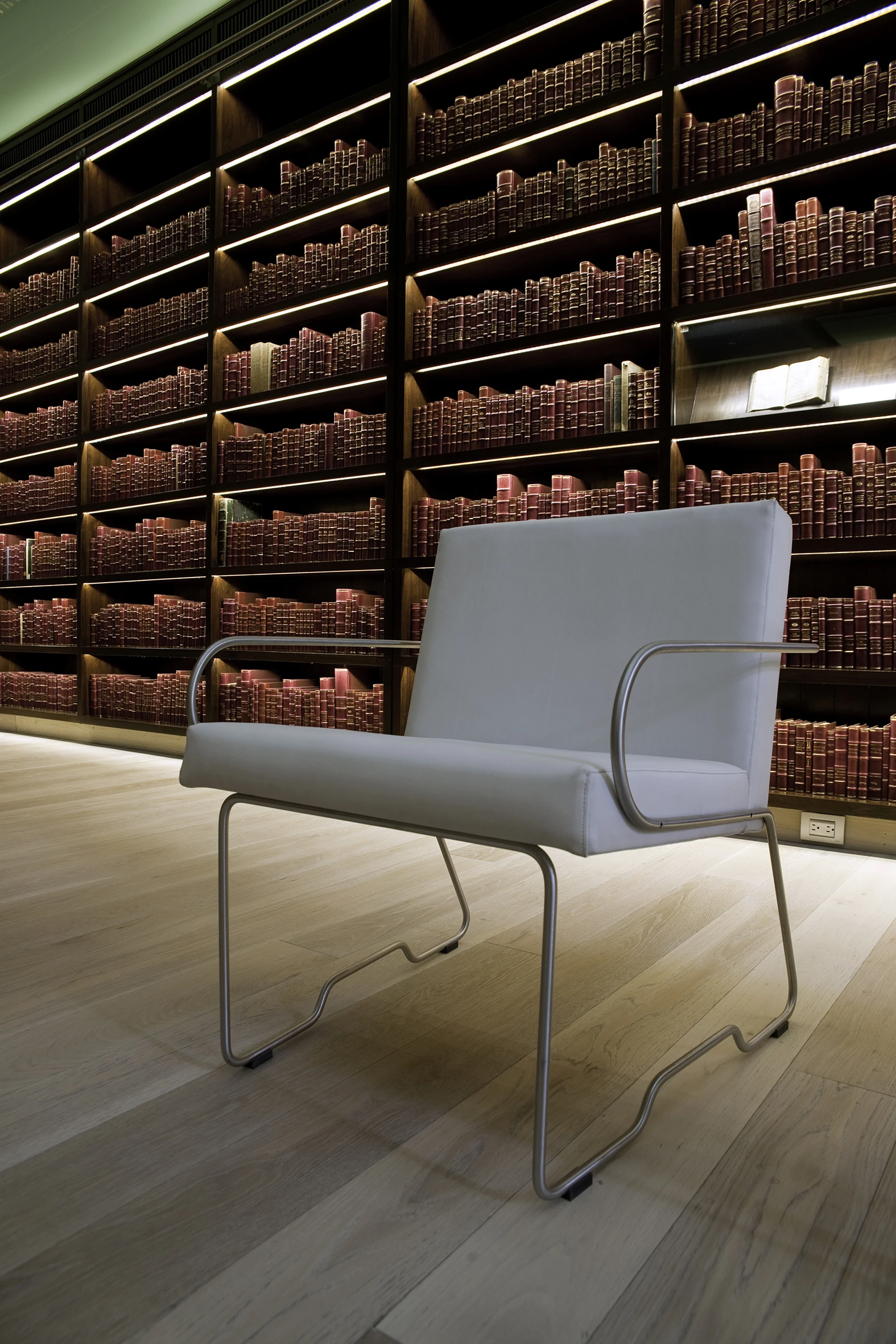 Linear strips of LED lights are mounted in each bookshelf