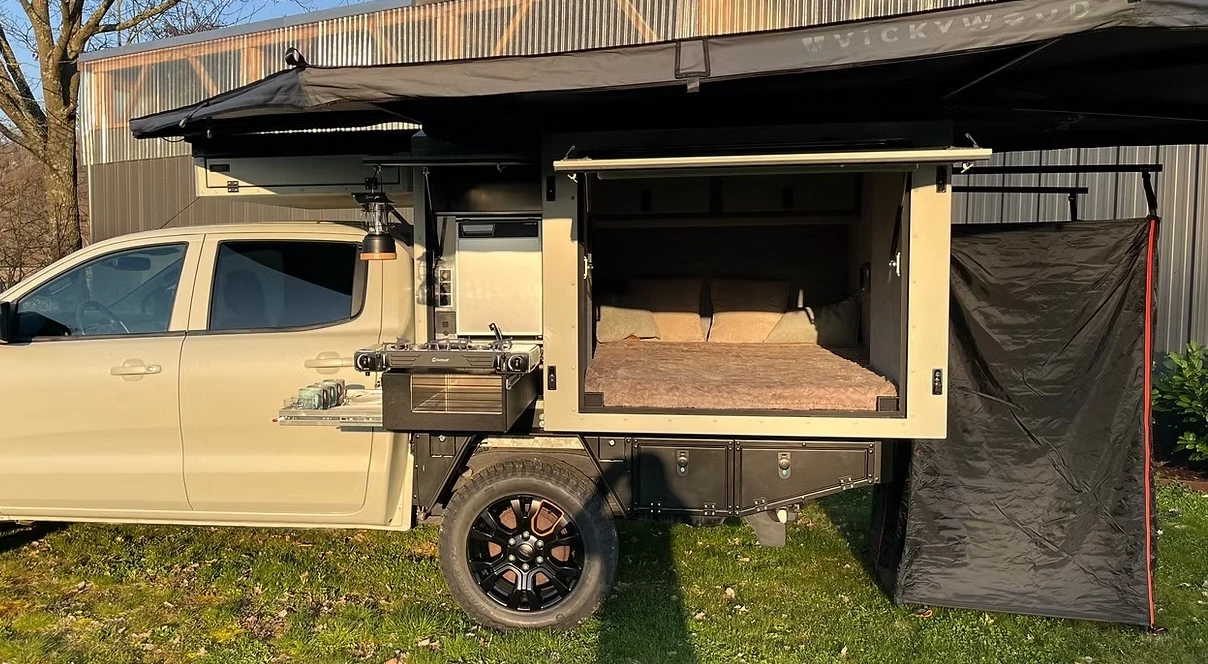 Truck camper canopy spits out private sleeper pod to greet the night